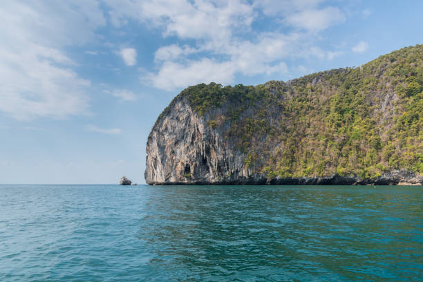 istock Mountain island on the sea blue sky 1182779120