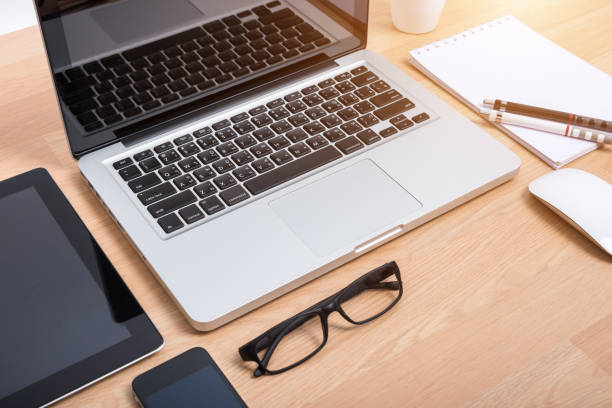 istock Top view open laptop with digital tablet and white smartphone 1182779209