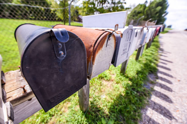 istock Row of vintage mailboxes next to a highway - U.S. mail 1182780281