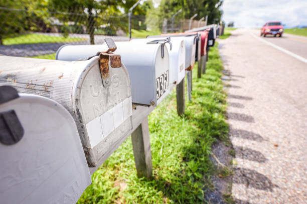 istock Row of vintage mailboxes next to a highway - U.S. mail 1182780284