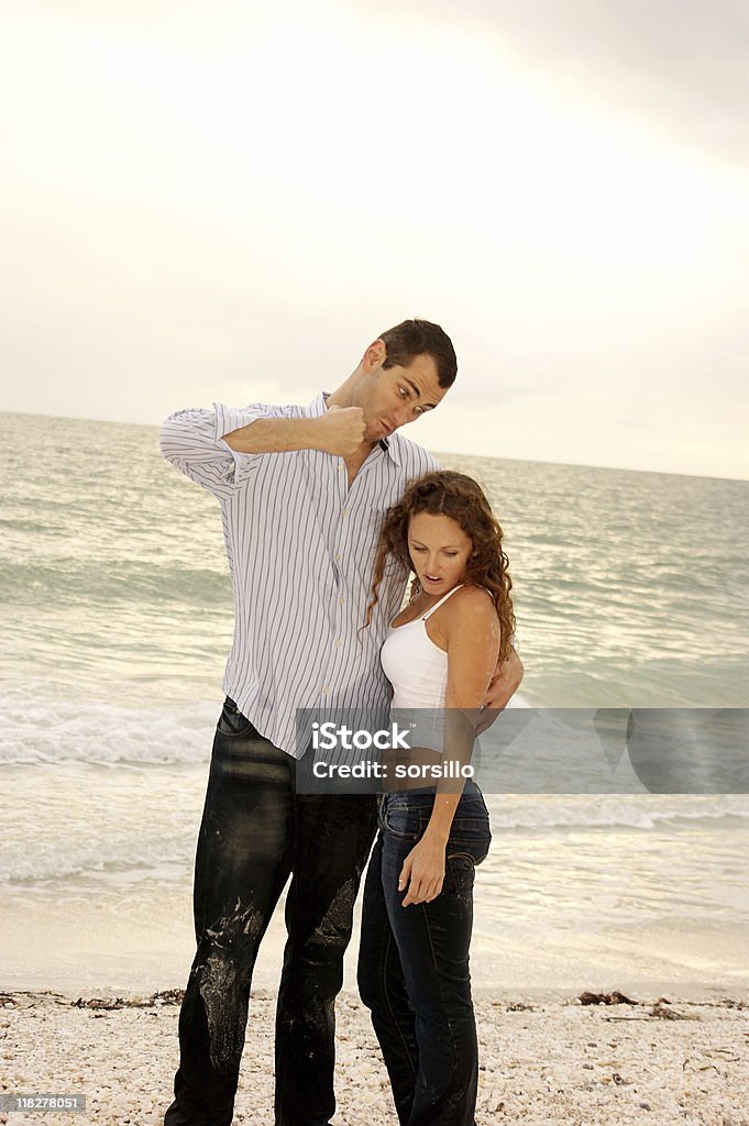 funny tall man pretending to punch short woman  Short Person Stock Photo