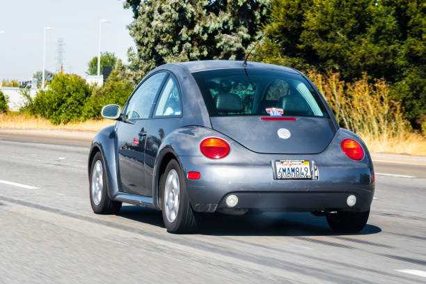 Oct 12, 2019 Redwood City / CA / USA - Volkswagen Beetle driving on the freeway in San Francisco Bay Area