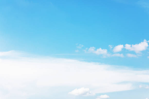 istock Blue sky background and white clouds soft focus, and copy space 1182790626