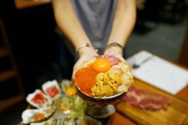 Photo of Mini donburi bowl - Japanese rice bowl topped with fresh tuna, sea urchin roe, salmon roe, scallop, sweet shrimp and topping egg yolk.