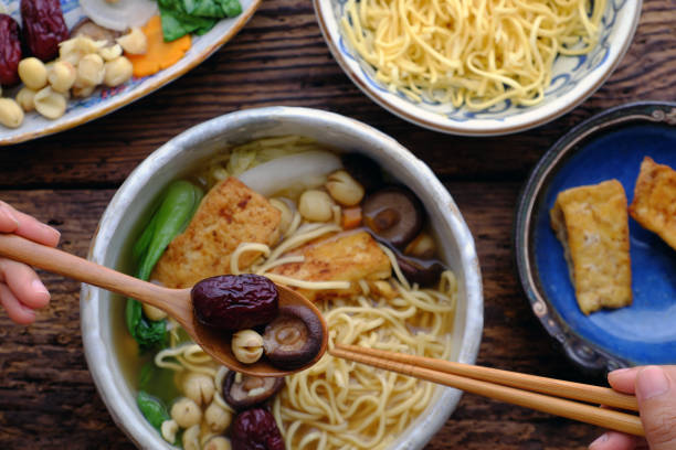 istock People eating Vietnamese vegan noodle soup for breakfast 1182795419