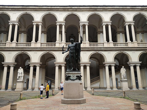 Tourists sightseeing at the pinacoteca di Brera art gallery, the main public gallery for paintings in Milan, Italy. It contains one of the foremost collections of Italian painting, which shares the site in the Palazzo Brera.