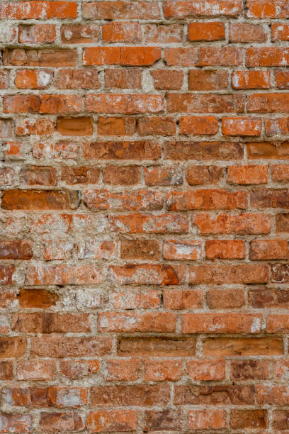 istock Macro texture of old red brick wall 1182798244