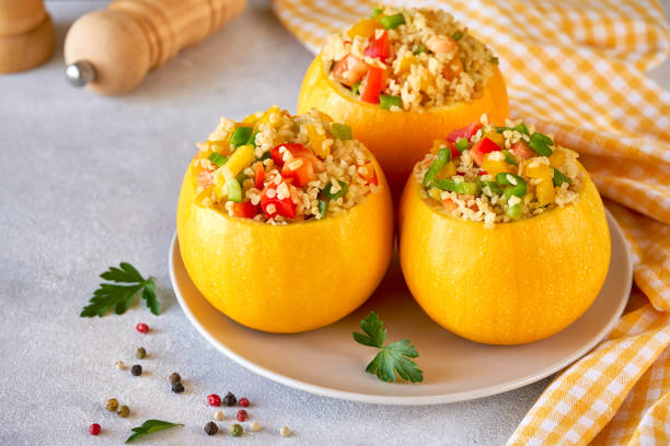 istock Round zucchini stuffed with bulgur and vegetables. Close up 1182799189