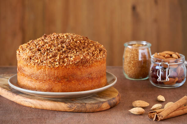 istock Almond cinnamon cake on wooden table. Close up 1182799863
