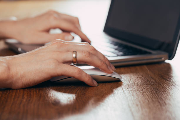 istock Woman using laptop on light table, closeup 1182799953