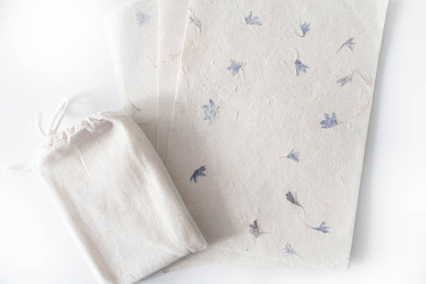 istock Mock up of tarot deck cotton bag with texture paper sheets on white background. Boho design of tarot cards pouch on white table with copy space for image or for text. 1182808978