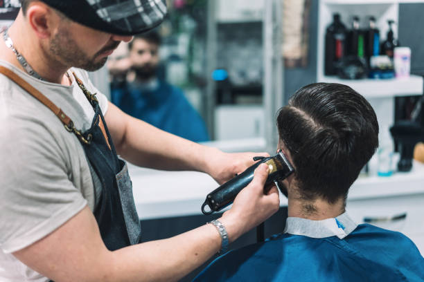 istock Young man getting elegant modern haircut 1182809891