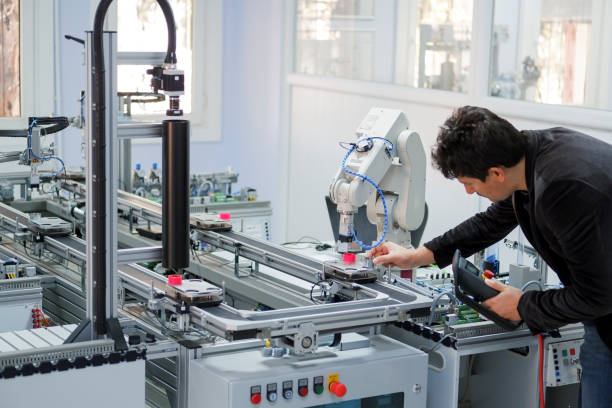 industry 4.0 automation line and robotic arm stock photo