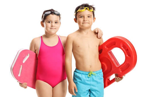 Children in swimming suits holding swimming pads isolated on white background
