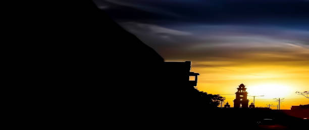 istock Dramatic sunset shot with trees and buildings.Dramatic sky with fantasy colors. 1182811143