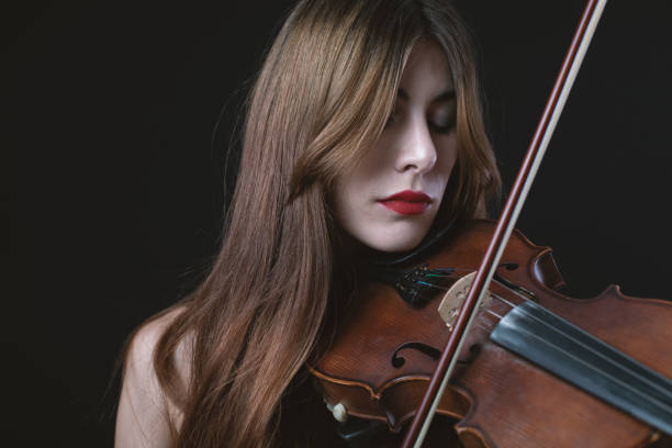 istock Beautiful Violinist Woman 1182811145