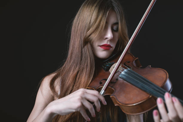 istock Beautiful Violinist Woman 1182811380