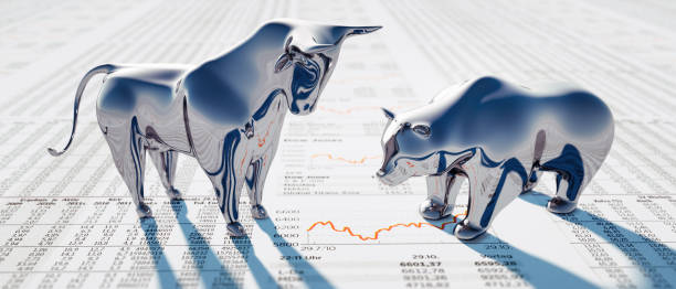 Silver Bull and Bear on Newspaper Silver Bull and Bear standing on a financial Newspaper with Charts trading stock pictures, royalty-free photos & images