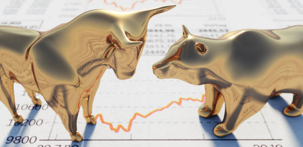 Bull and Bear on financial Newspaper Close up of golden Bull and Bear standing on a Stock Market Newspaper bull market stock pictures, royalty-free photos & images