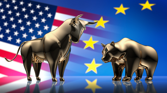 Golden Bull and Bear with US and European Flags in the Background
