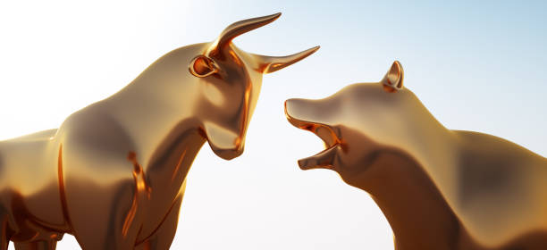 Closeup of golden Bull and Bear Close up of golden Bull and Bear against a bright blue Sky photography hessen germany central europe stock pictures, royalty-free photos & images