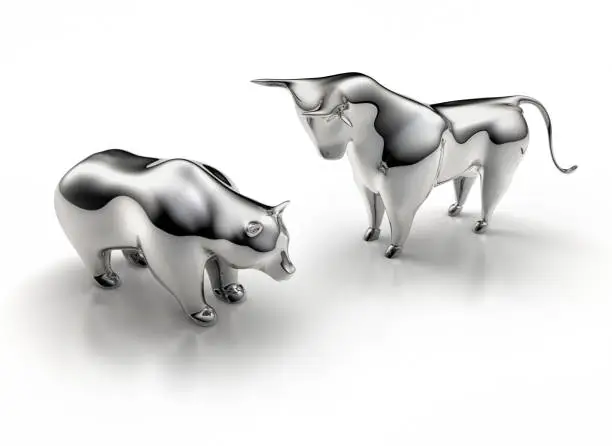 Silver Bull and Bear standing on a white shiny Background