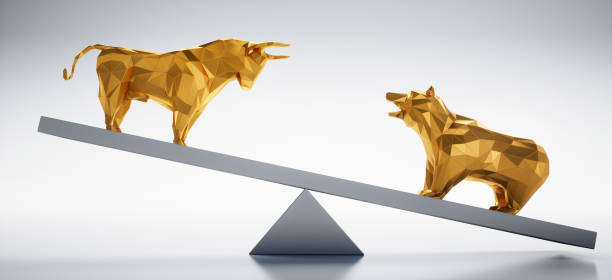 istock Golden Bull and Bear on Seesaw 1182812311
