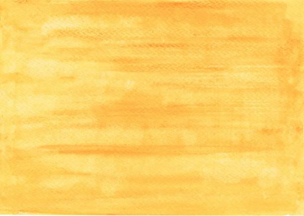 Handpainted simple watercolor wash background in yellow and orange color stock photo