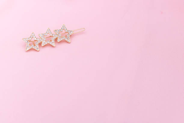 istock Luxury hair clip on pink fabric with copyspace. 1182815251