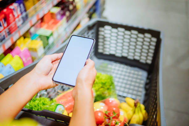 istock phone with empty blank white screen shopping cart on background copy space 1182815368