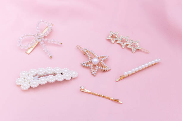 istock Luxury hair clips on pink fabric with copyspace. 1182815688