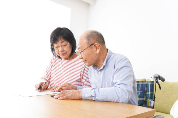 istock Senior couple signing a document 1182815692