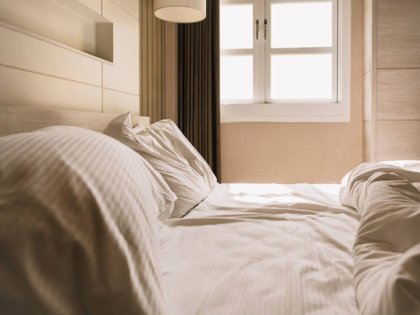 istock Bedroom mattress duvet pillows messed up Hotel Interior 1182820149