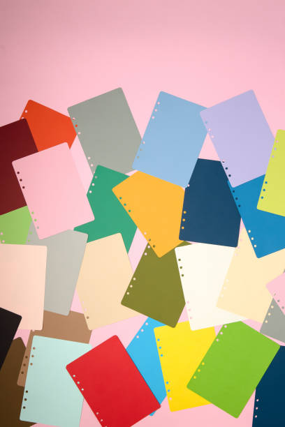 istock There are many different colored papers on the pink floor. 1182820705
