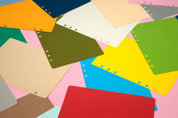 istock There are many different colored papers on the pink floor. 1182820706