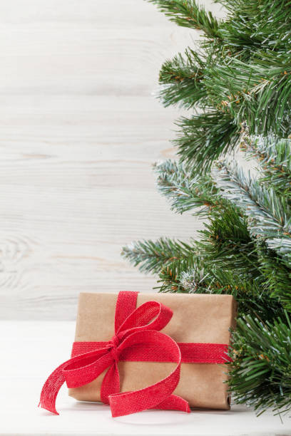 istock Christmas card with fir tree and gift box 1182821613