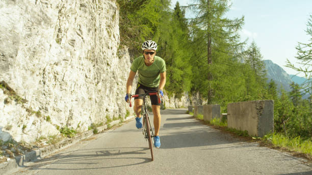 istock LOW ANGLE: Athletic man training for a cyclocross race in the sunny mountains. 1182825651