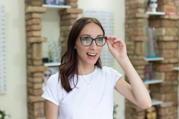 istock Woman Trying On Eyeglasses In Store 1182826751