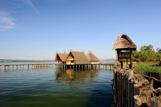 Lake Constance in Unteruhldingen with the pile dwellings and two swans