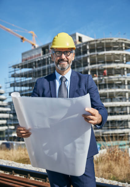 istock senior businessman architect helmet construction site building architecture 1182829450