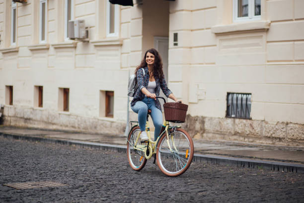 istock Beautiful woman travels on a bicycle 1182830607