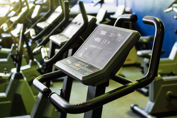istock Group of Exercising bikes in a gym 1182832279