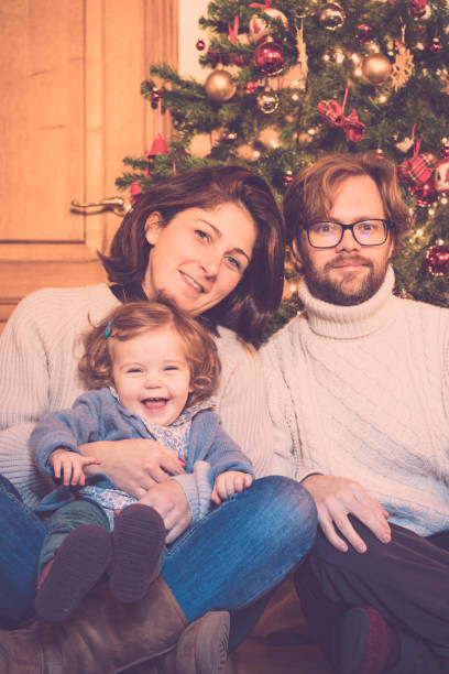 istock family portrait under the Christmas tree 1182833454