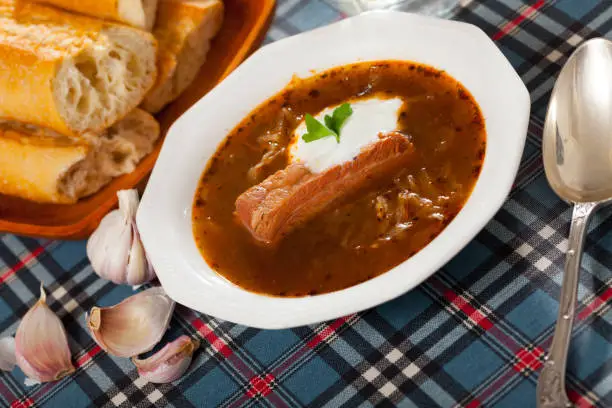 Photo of Shchi on mushroom broth with pork and sour cream