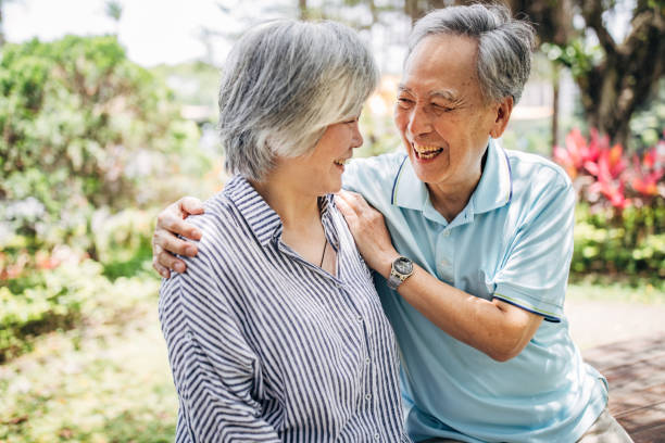 istock Charming senior couple relaxing in park 1182836468
