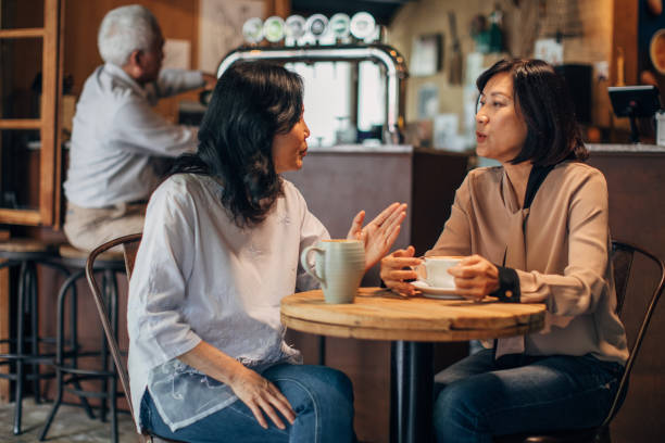 istock Senior ladies on coffee break in cafe 1182840636