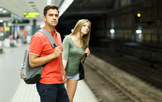 istock Couple is traveling and waiting train on platform 1182840718