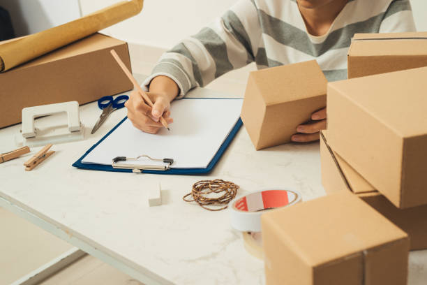 istock Worker are writing on the clipboard, Checking items list. 1182841899