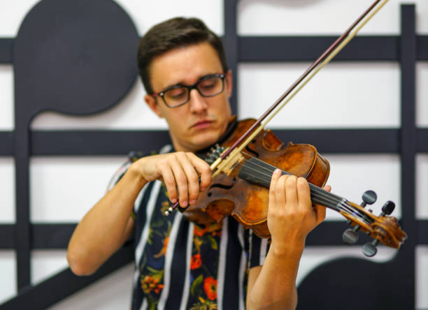 istock Young musician playing the violin, Close Up 1182842433