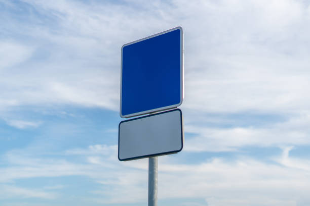 istock empty road sign with copy space mock-up design against the sky 1182842539